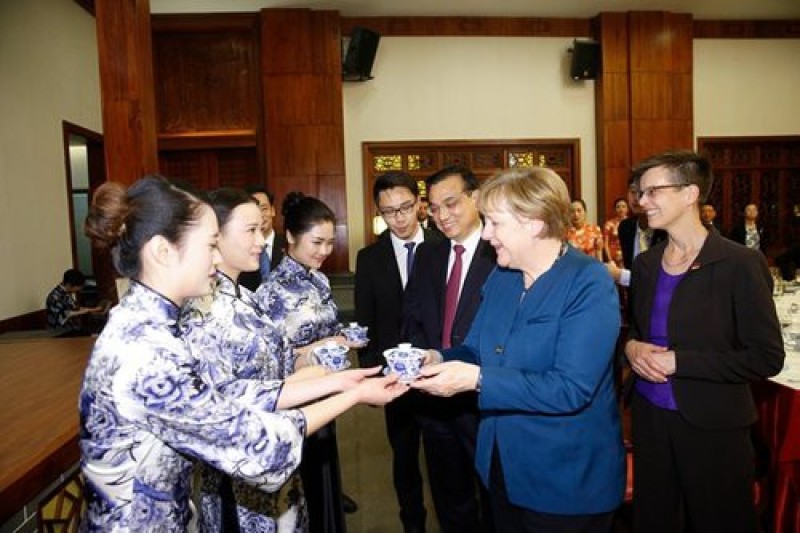 Ready to sip! Merkel can't wait.